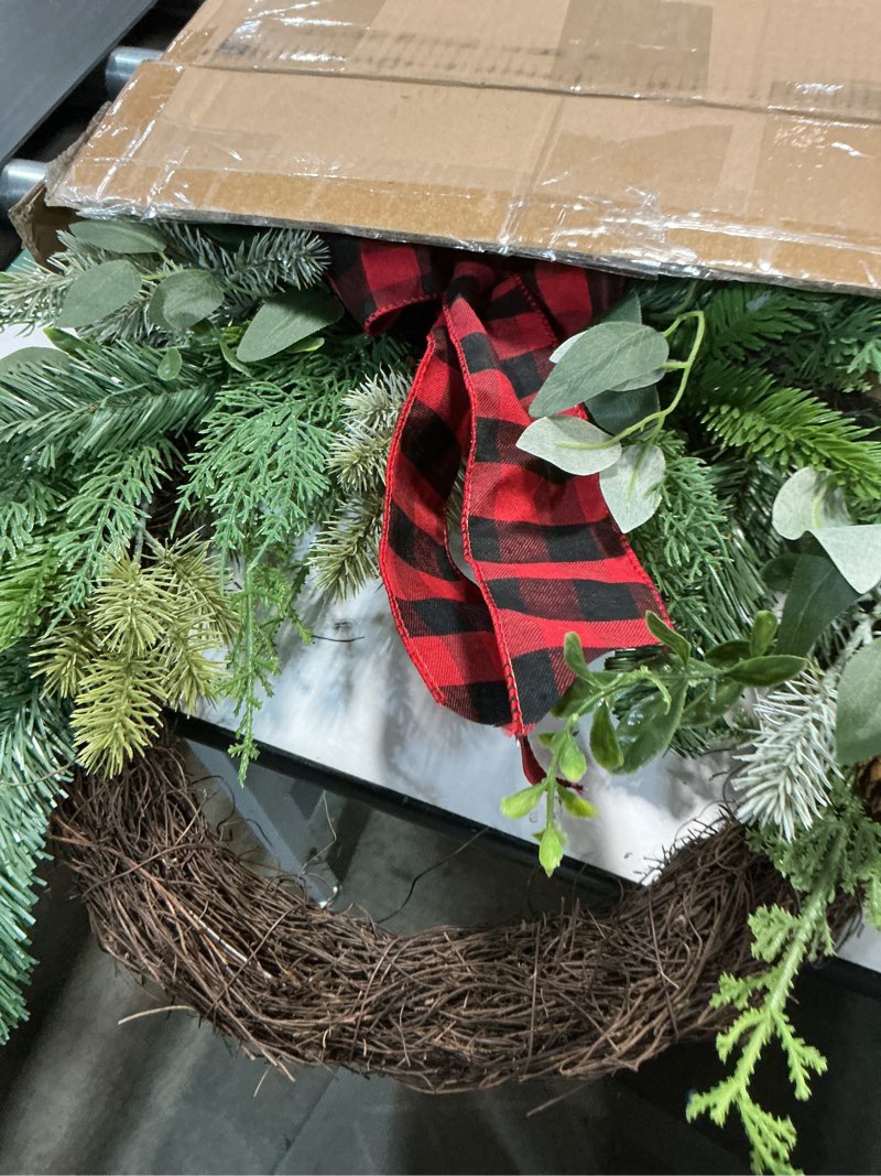 Condition photo showing Good Condition for National Tree Company Artificial Mixed Pine and Bow Christmas Wreath, Evergreen Branch Tips and Leafy Greens Decorated with Petite Pinecones, Red & Black Plaid Bow, 22 in