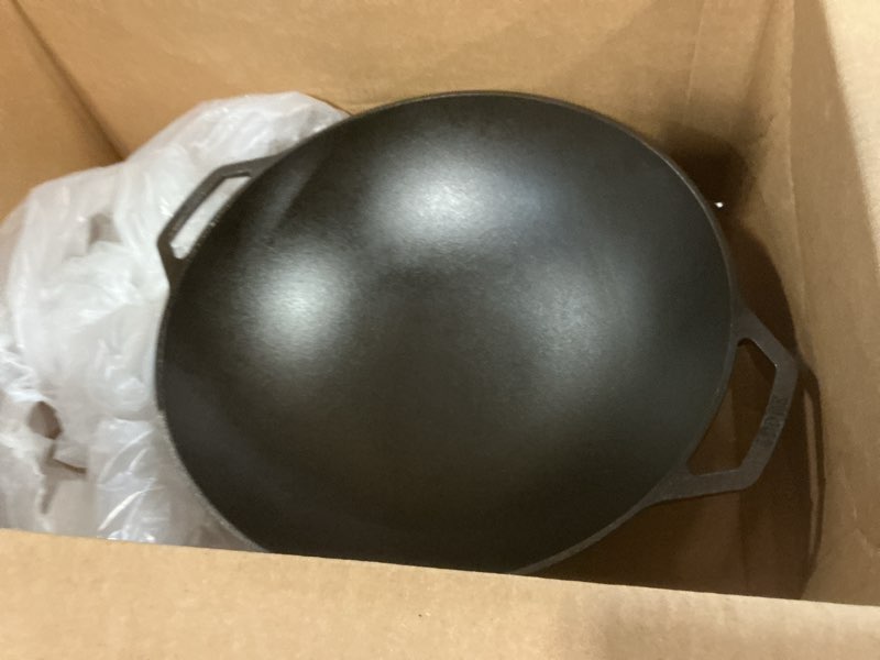 Condition photo showing Good Condition for Lodge Pre-Seasoned Cast Iron WOK - Dual Assist Handle - Use in the Oven, on the Stove, or on the Grill - 14 Inch