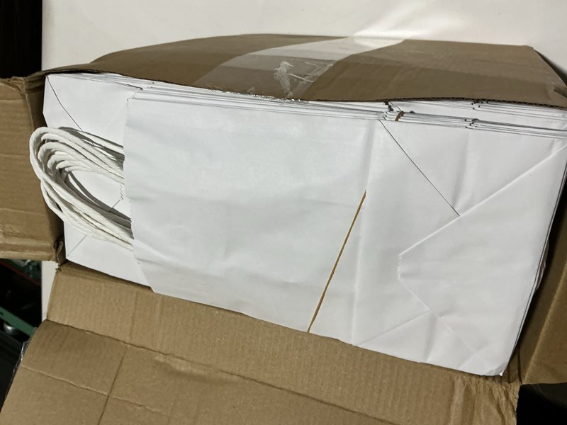 Condition photo showing Good Condition for XPCARE 200Pcs Paper Gift Bags 5.25x3.25x8.25'', Gift Wrap Bags with Handles White Kraft Paper Bags for Small Business Paper Bags Bulk for Birthday Party Favors Shopping Retail 1 Count (Pack of 200) White