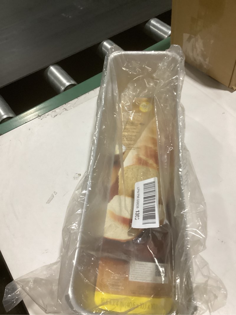 Condition photo showing New/Like New for wilton long 16 x 4 in aluminum loaf pan, oversized bakeware for pound cakes & more, durable, even heating, rust-resistant, professional quality, packaging may vary jumbo