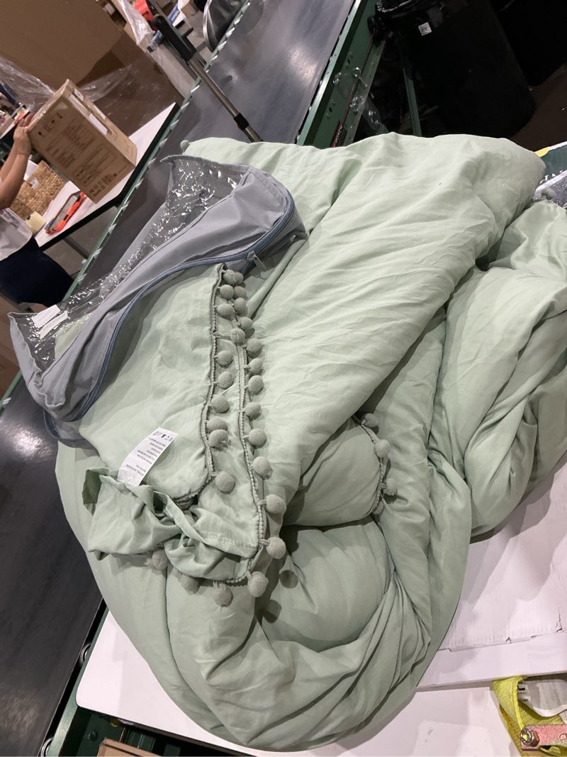 Condition photo showing Good Condition for 3-piece duvet cover set, ball fringe design, soft dark sage green, 1 duvet cover and 2 pillowcases with ball fringe, queen size, green