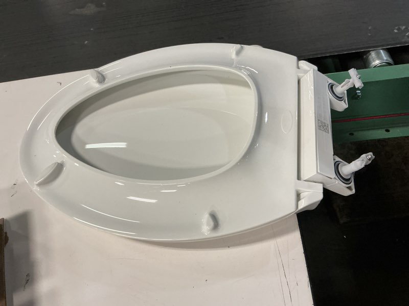 Condition photo showing As Is for KOHLER 4636-RL-0 Cachet ReadyLatch Elongated Toilet Seat Slow Close, Soft Close Toilet Seat Quiet Lid, Contoured Grip-Tight Bumpers Installation Hardware, Apartment Essentials, White White Elongated Ready Latch