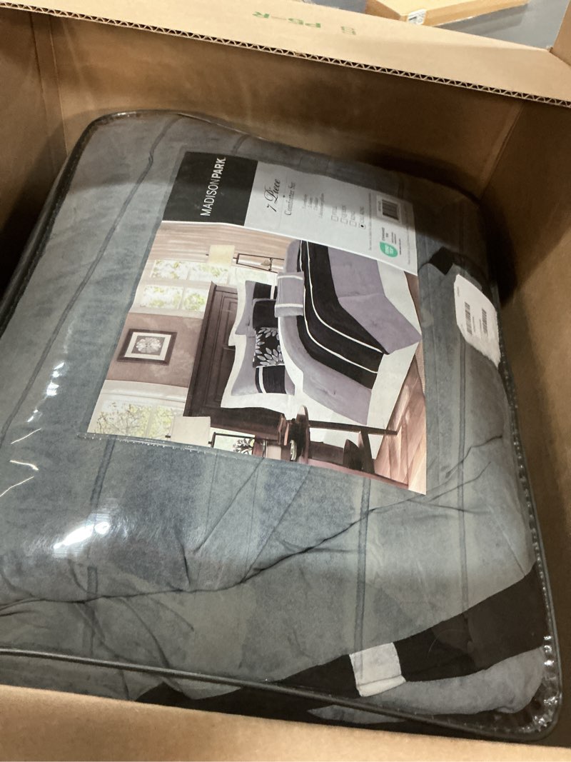 Condition photo showing Good Condition for Madison Park - Palmer 7 Piece Comforter Set - Black and Gray - California King - Pieced Microsuede - Includes 1 Comforter, 3 Decorative Pillows, 1 Bed Skirt, 2 Shams Black California King (104 in x 92 in)