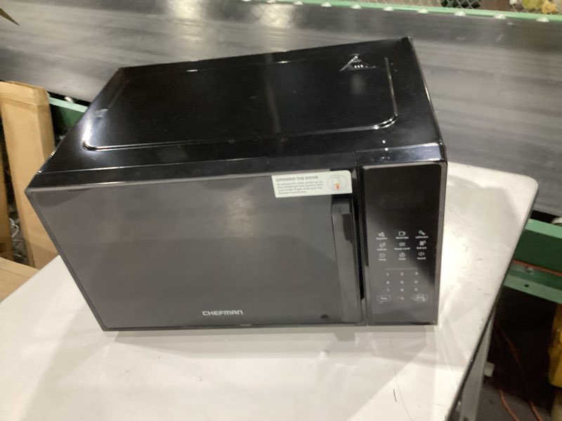 Condition photo showing Good Condition for chefman countertop microwave oven 1.1 cu. ft., 1000 watts with 10 power levels, 6 cooking presets with one-touch express cook, eco mode, child safety lock, & mute button - black