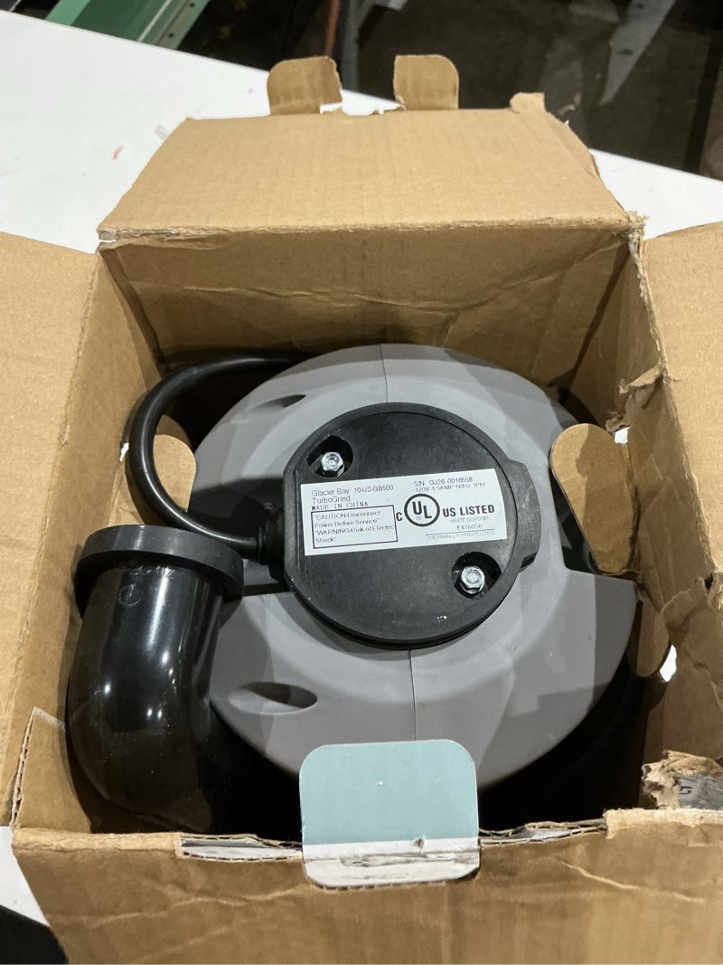 Condition photo showing As Is for turbogrind 1/2 hp. continuous feed garbage disposal with power cord