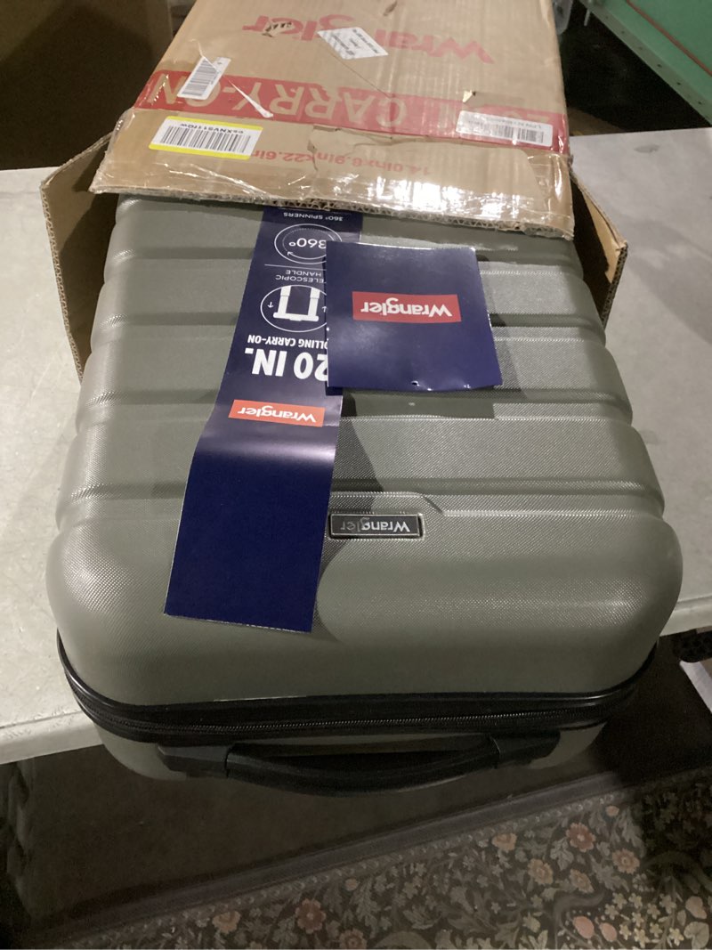 Condition photo showing Good Condition for Wrangler 22" Hardside Spinner Carry-On Luggage, Olive