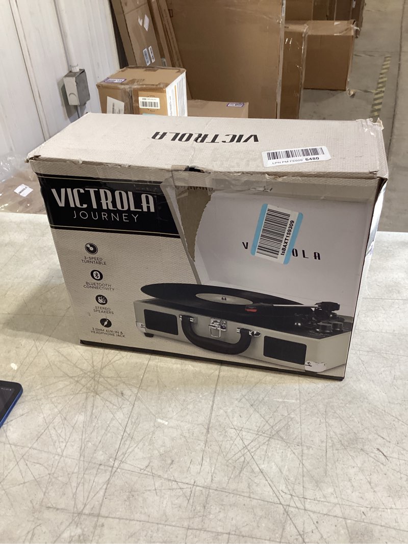 Condition photo showing New/Like New for Victrola Journey Bluetooth Portable Suitcase Record Player – with Built-in Speakers, 3 Speed Vinyl Record Player, RCA Out, Headphone Jack (White)