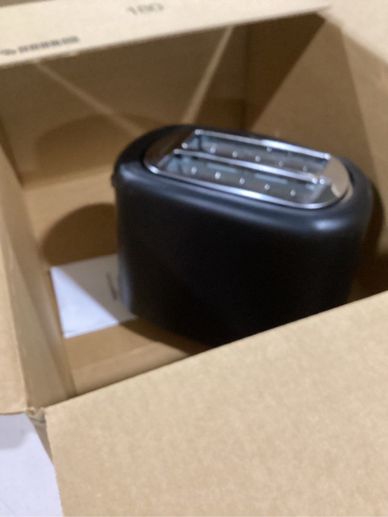 Condition photo showing As Is for Amazon Basics 2 Slice Toaster, With 6 Browning Settings, Extra Wide Slots For Bagels and Special Breads, Removable Easy-to-Clean Crumb Tray, Cancel/Defrost/Bagel Buttons, 900W, Black & Silver 2 Slice Silver Front