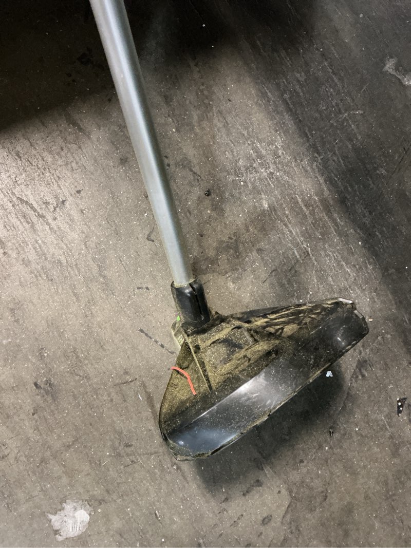Condition photo showing As Is for ego powerload 56-volt 15-in telescopic shaft battery string trimmer 2.5 ah.