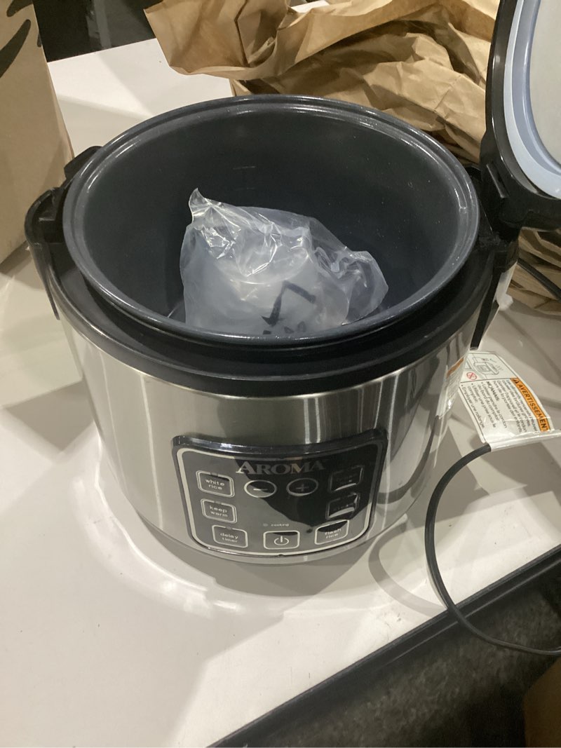 Condition photo showing Good Condition for aroma digital rice cooker, 4-cup (uncooked) / 8-cup (cooked), steamer, grain cooker, multicooker, 2 qt, stainless steel exterior, arc-914sbd 4 cup uncooked / 8 cup cooked