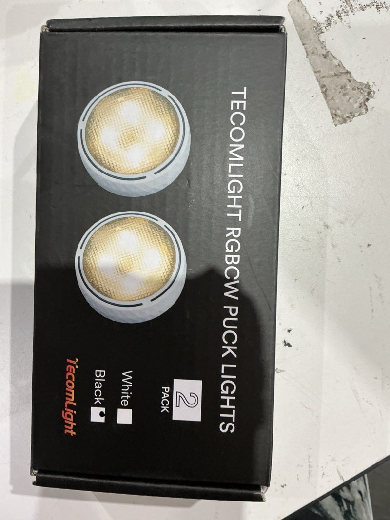 Condition photo showing As Is for tecomlight led puck lights with remote control, battery operated wireless closet lights, under cabinet lighting stick on tap push light, color changing under counter light for kitchen, 2 pack - black 2 pack black