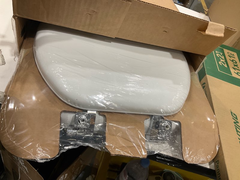 Condition photo showing item condition for Mayfair Padded Toilet Seat with Chrome Hinges, Soft Vinyl over Wood Core Seat, Made in USA, Round, White Elongated Seat