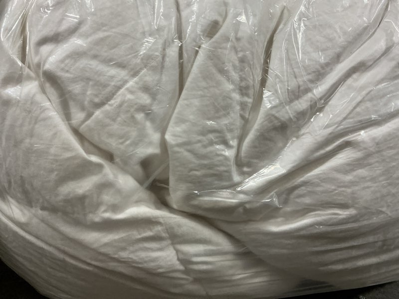 Condition photo showing As Is for comforter, king/calking