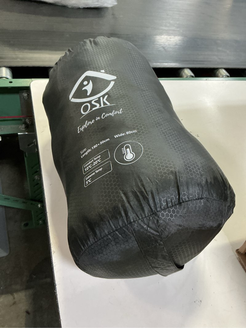 Condition photo showing As Is for (color black)oaskys camping sleeping bag - 3 season warm & cool weather - summer spring fall lightweight waterproof for adults kids - camping essentials gear accessories hiking sleep must haves