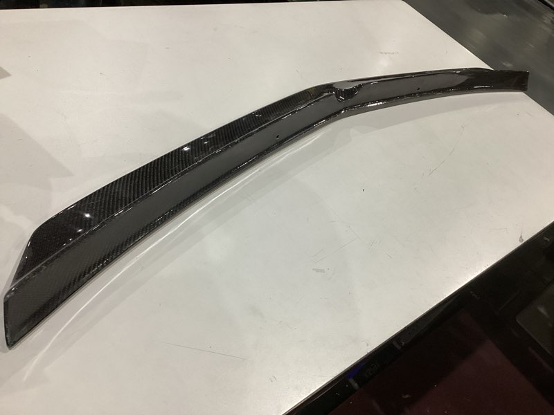 Condition photo showing As Is for carbon fiber rear trunk spoiler lip