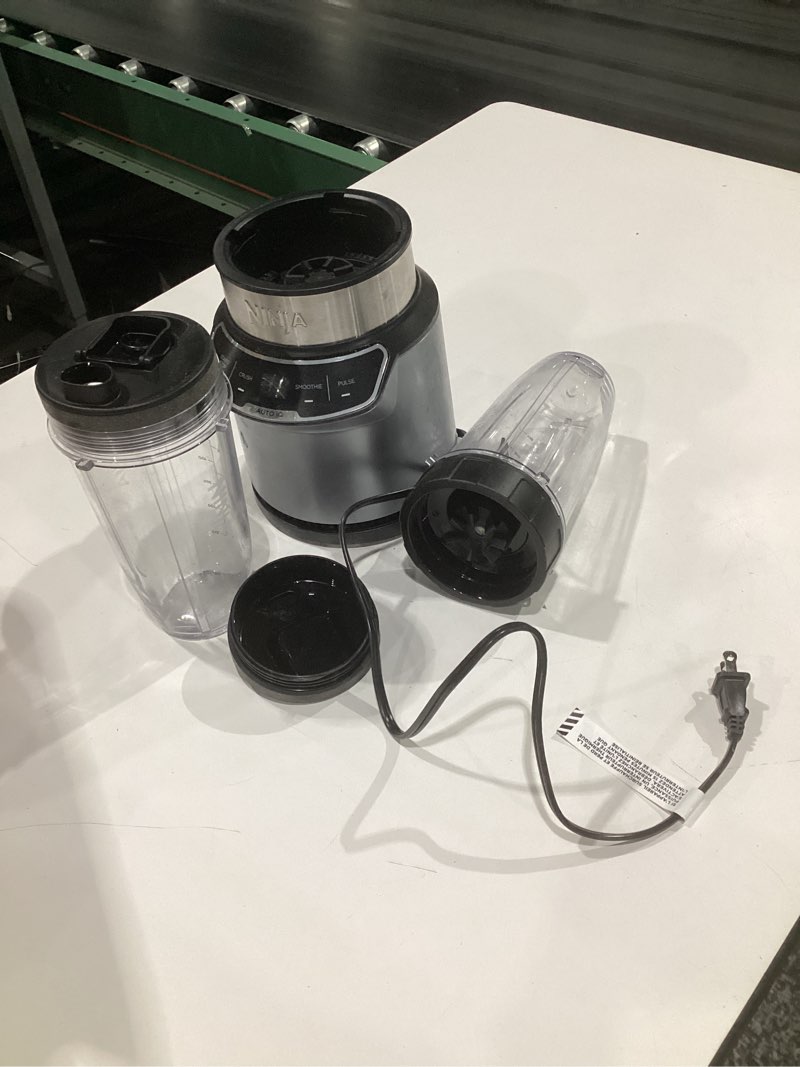 Condition photo showing As Is for (used, not tested)ninja | blender | nutri pro | single serve | for smoothies, salsa, shakes and frozen drinks | includes 2 smoothie cups & lids | crushes ice, fruit & veggies |silver | bn401 auto blend 1000-peak-watts