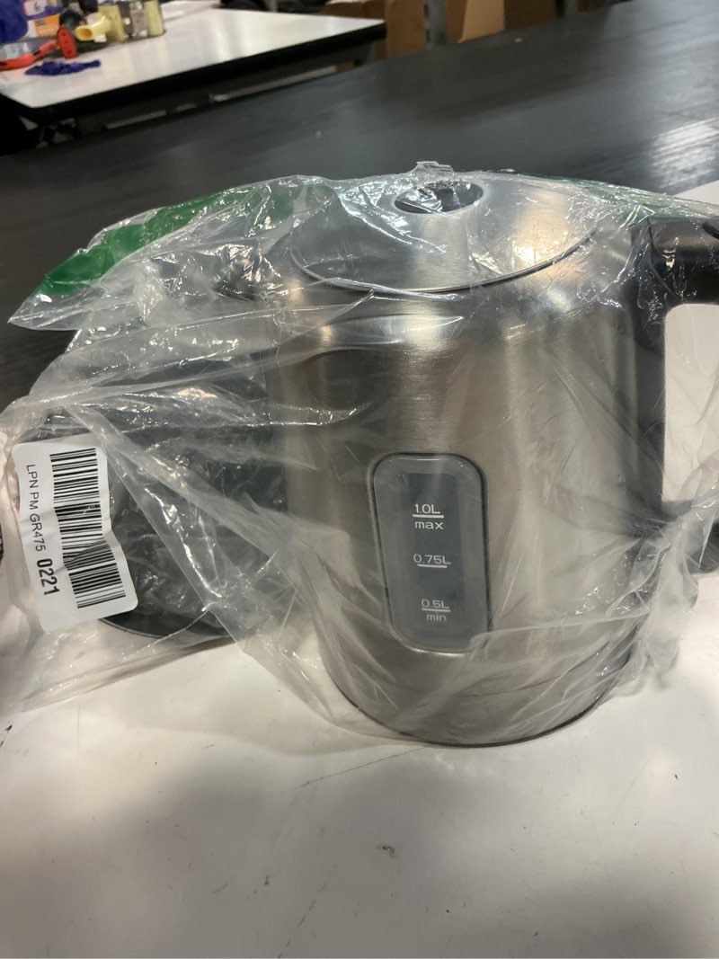 Condition photo showing As Is for amazon basics electric stainless steel kettle for tea and coffee, bpa-free, fast boiling, auto shut-off, 1 liter, 1500w, black and silver