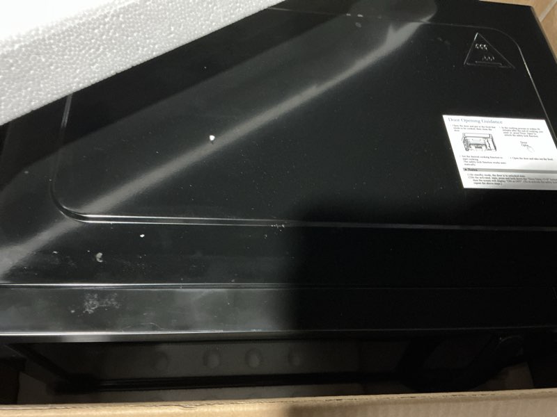 Condition photo showing Good Condition for Farberware 1.1 Cu. Ft. Countertop Microwave Oven – 1000 Watts Power, Auto Cook Settings, Defrost, Easy Clean and Child Safety Lock - Stainless and Black 1.1 Cu. Ft. Black Stainless