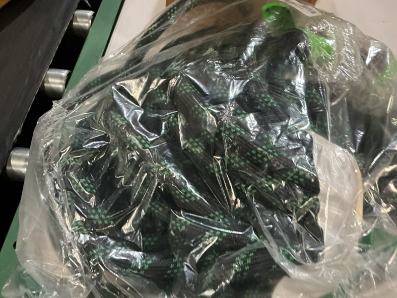 Condition photo showing As Is for 100ft flexible garden hose, lightweight water hose, non-expandable garden hose with 10 function sprayer nozzle, kink-free triple-layer composite watering hose for yard, lawn, outdoor and car washing black and green 100ft
