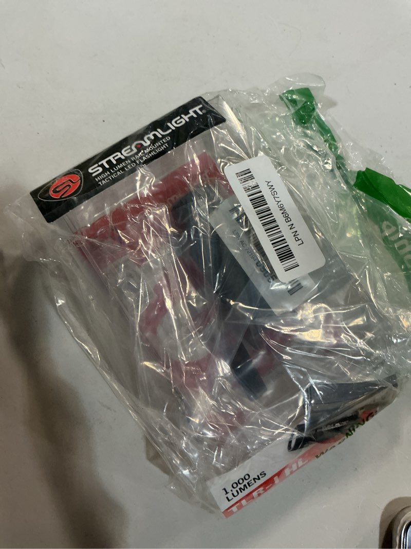 Condition photo showing New/Like New for streamlight 69260 tlr-1 hl 1000-lumen 20000 candela rail-mounted tactical weapon light with specific compatibility rail locating keys, black non-rechargeable black