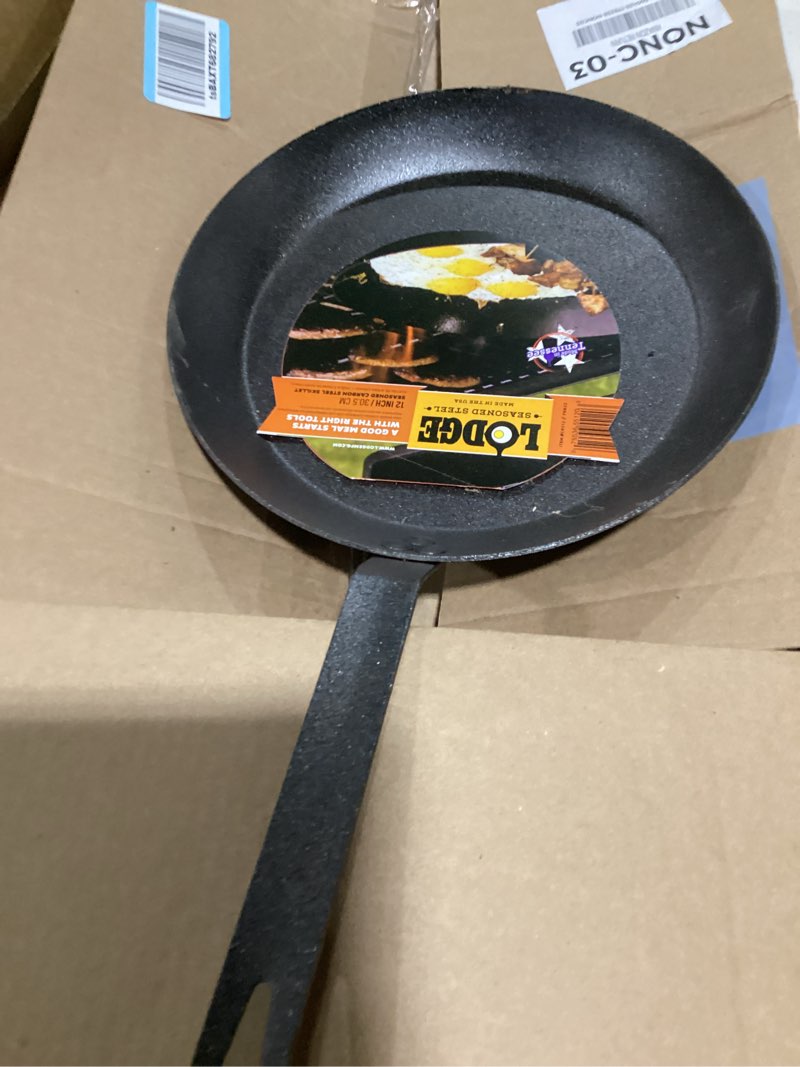 Condition photo showing New/Like New for lodge pre-seasoned carbon steel skillet - use in the oven, on the stove, on the grill, or over a campfire - 12 inch