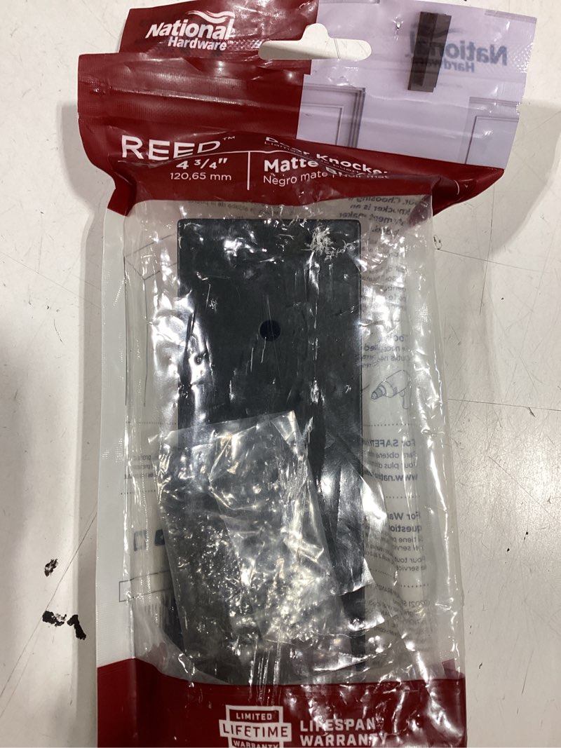 Condition photo showing New/Like New for national hardware n336-703 reed door knocker, matte black, 4-3/4" matte black 4-3/4"