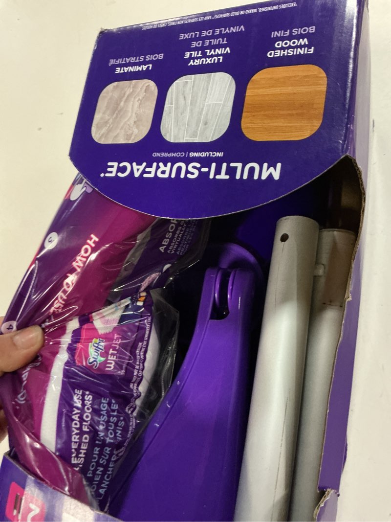 Condition photo showing As Is for swiffer wetjet 11 in. w wet mop kit