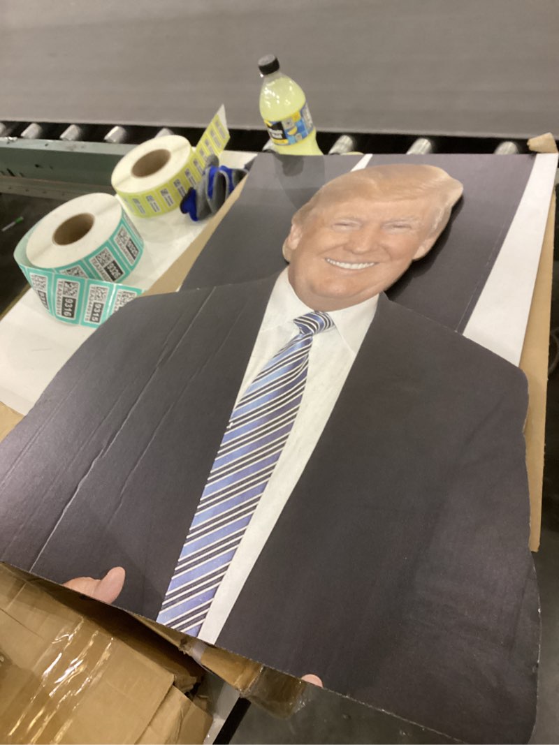 Condition photo showing New/Like New for Card board donald tump