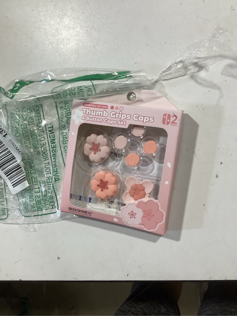 Condition photo showing New/Like New for geekshare sakura cross d-pad button caps thumb grip caps set compatible with switch 2, abxy key buttons sticker cover caps for switch 2, cherry pink