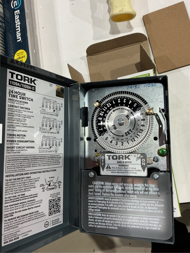 Condition photo showing As Is for nsi industries tork 1109a indoor 40-amp multi-volt mechanical lighting and appliance timer - 24-hour programming - multiple on/off settings - 120/208-277-volt - grey 2.9 x 4.7 x 7.9 inches