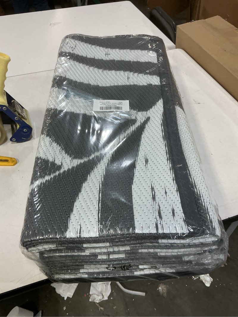 Condition photo showing New/Like New for OLANLY Waterproof Outdoor Rug 9x12 ft, Reversible Outdoor Plastic Straw Rug with Leaf Pattern, RV Mat, Indoor Outdoor Carpet for Patio, Camping, Balcony, Deck, Backyard, Grey & White Grey & White 9' x 12' (Rectangular)