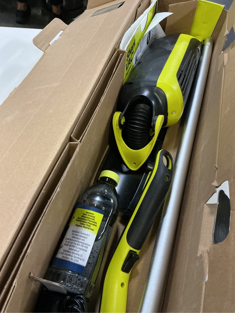 Condition photo showing As Is for shark vacmop cordless hard floor vacuum mop includes 2 disposable vacmop pads and a 12oz vacmop solution, charcoal gray, vm180