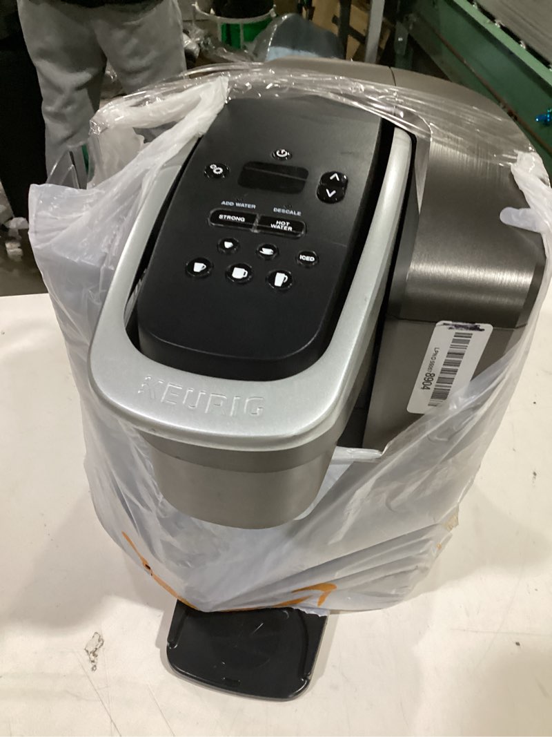 Condition photo showing As Is for keurig k-elite single serve k-cup pod coffee maker, with strength and temperature control, iced coffee capability, 8 to 12oz brew size, programmable, brushed slate