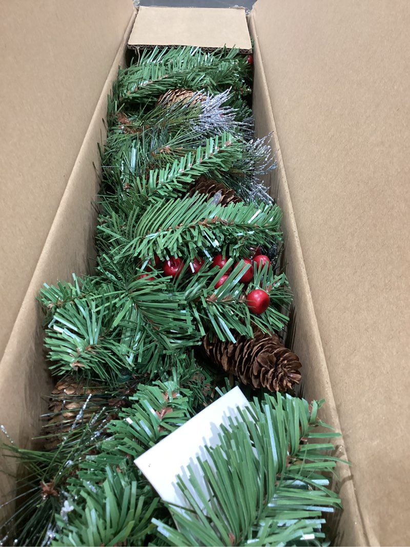 Condition photo showing Good Condition for national tree company 9 ft pre-lit crestwood spruce artificial christmas garland, christmas decoration with glitter, pinecones, red berries, 50 clear lights, 180 tips, green plug in tree