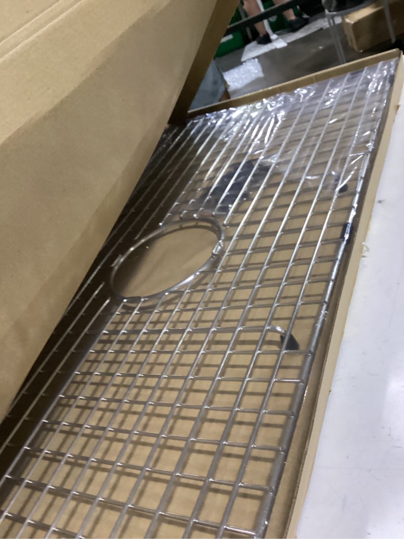 Condition photo showing New/Like New for serene valley sink bottom grid 29-1/2" x 15-9/16", centered drain with corner radius 3/8", sink protector ndg3016c