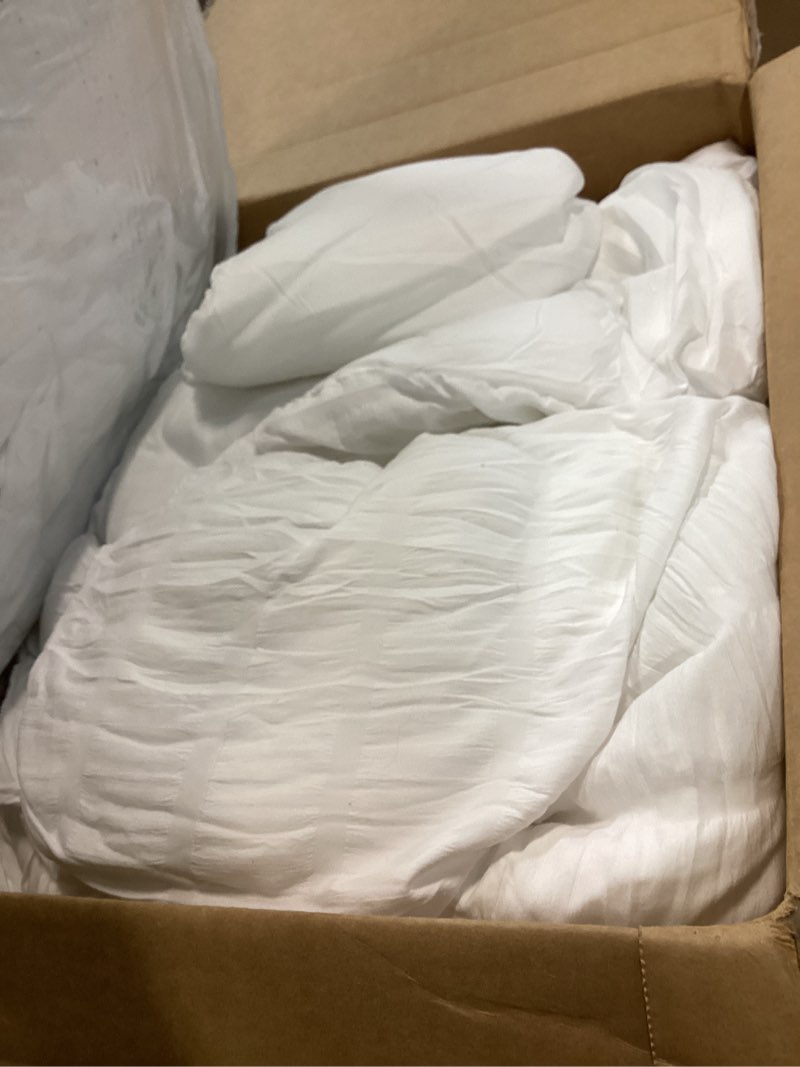 Condition photo showing As Is for CozyLux Queen Comforter Set White Seersucker 7 Pieces Bed in a Bag Queen Comforter Set with Sheets, Luxury Soft Bedding Set with Down Alternative Comforter, Sheets, Pillowcases & Shams for All Seasons White Queen