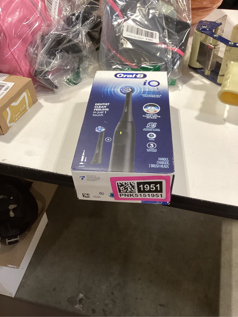 Condition photo showing New/Like New for oral-b io series 2 rechargeable electric powered toothbrush starter kit, night black with 2 brush heads - automatic pressure sensor to protect gums - 3 modes - 2 min timer