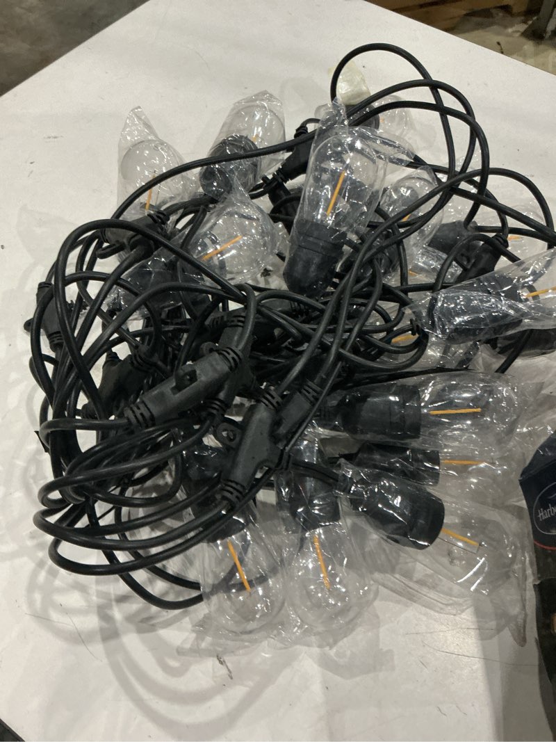 Condition photo showing As Is for harbor breeze 48-ft solar black indoor/outdoor string light with 20 white -light led edison bulbs