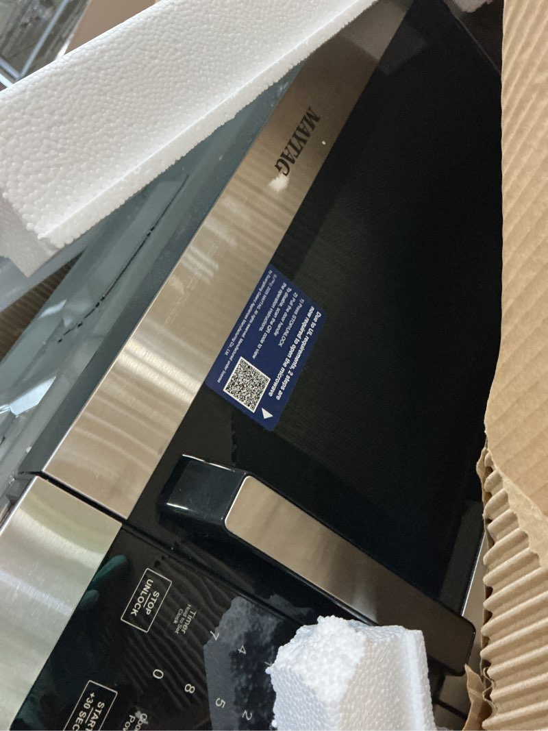 Condition photo showing As Is for maytag 1.3 cu ft microwave oven silver