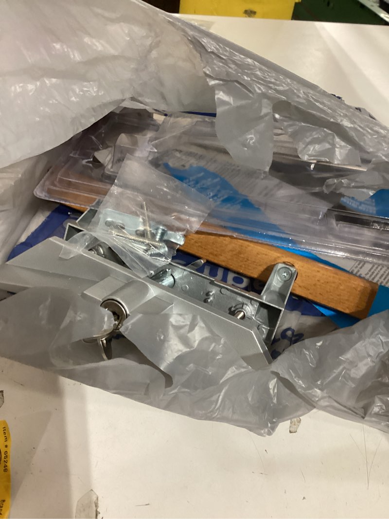 Condition photo showing As Is for wright products vk1104 locking reversible door handle  aluminum/wood  oak
