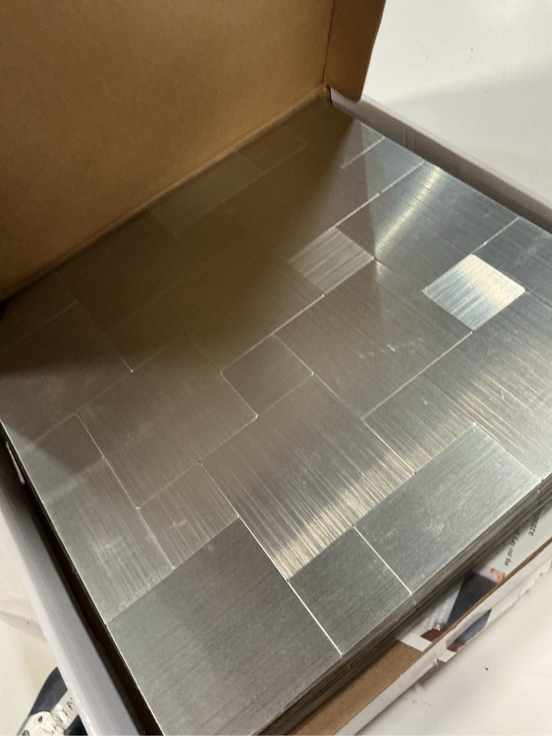 Condition photo showing New/Like New for art3d peel and stick on metal steel backsplashes, 10-piece puzzle brush silver square