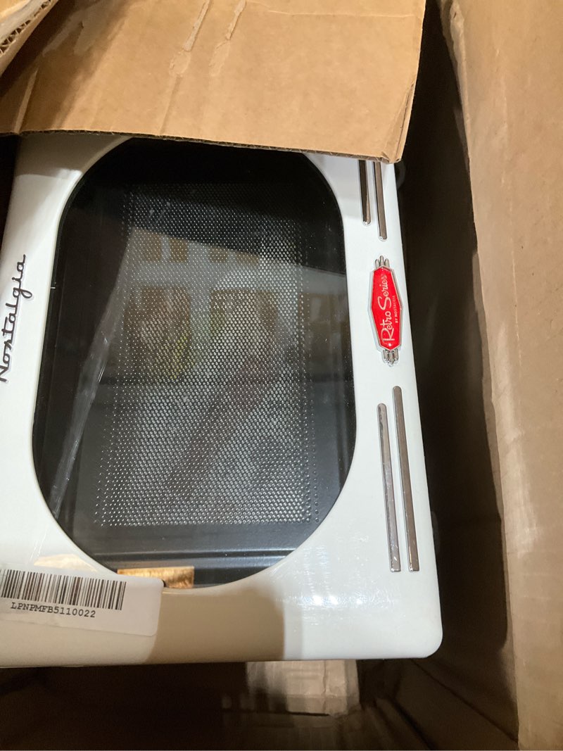 Condition photo showing New/Like New for Nostalgia Retro Compact Countertop Microwave Oven - 0.7 Cu. Ft. - 700-Watts with LED Digital Display - Child Lock - Easy Clean Interior - Ivory Retro Classic 0.7 Cu. Ft. Ivory