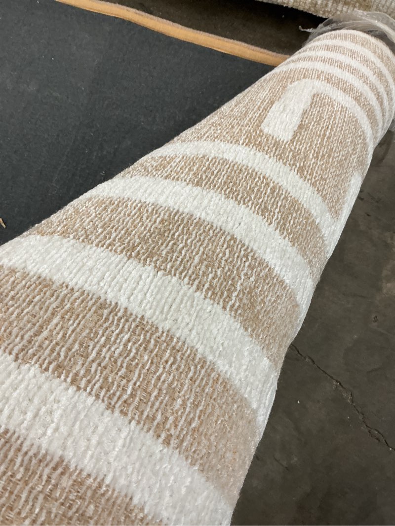 Condition photo showing As Is for origin 21 path of ivory 5 x 8 (ft) prairie warm indoor area rug