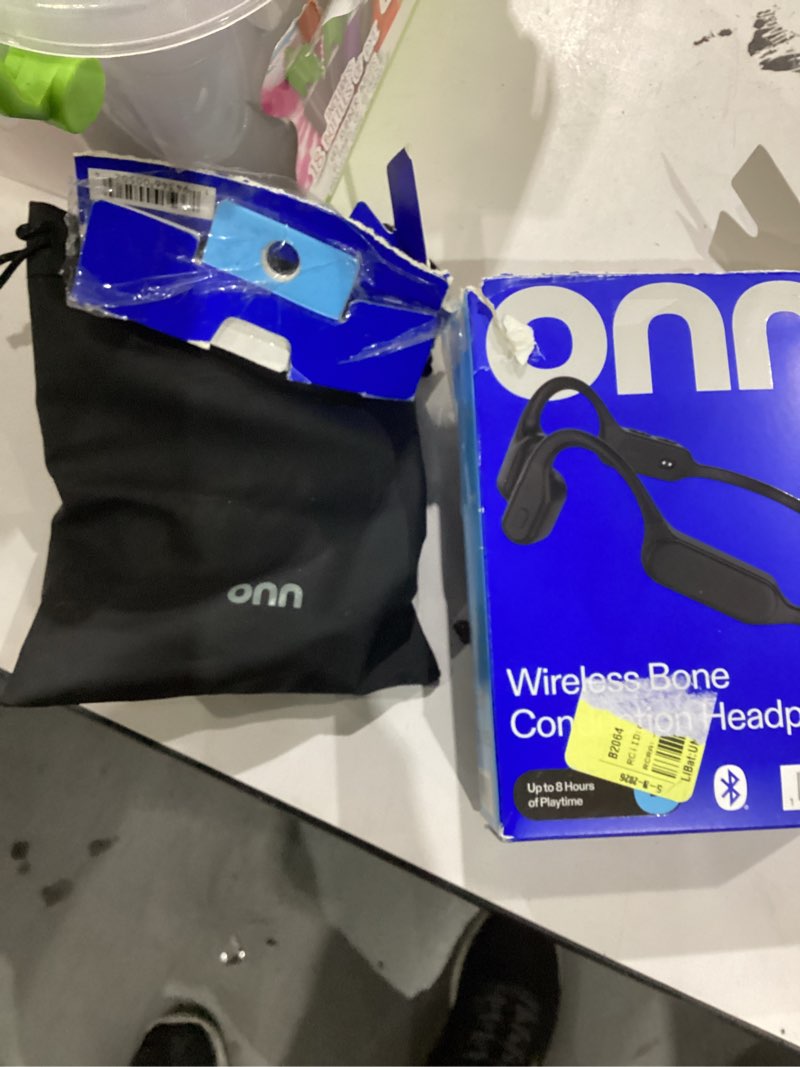 Condition photo showing As Is for onn. wireless bone conduction headphones with storage pouch, new