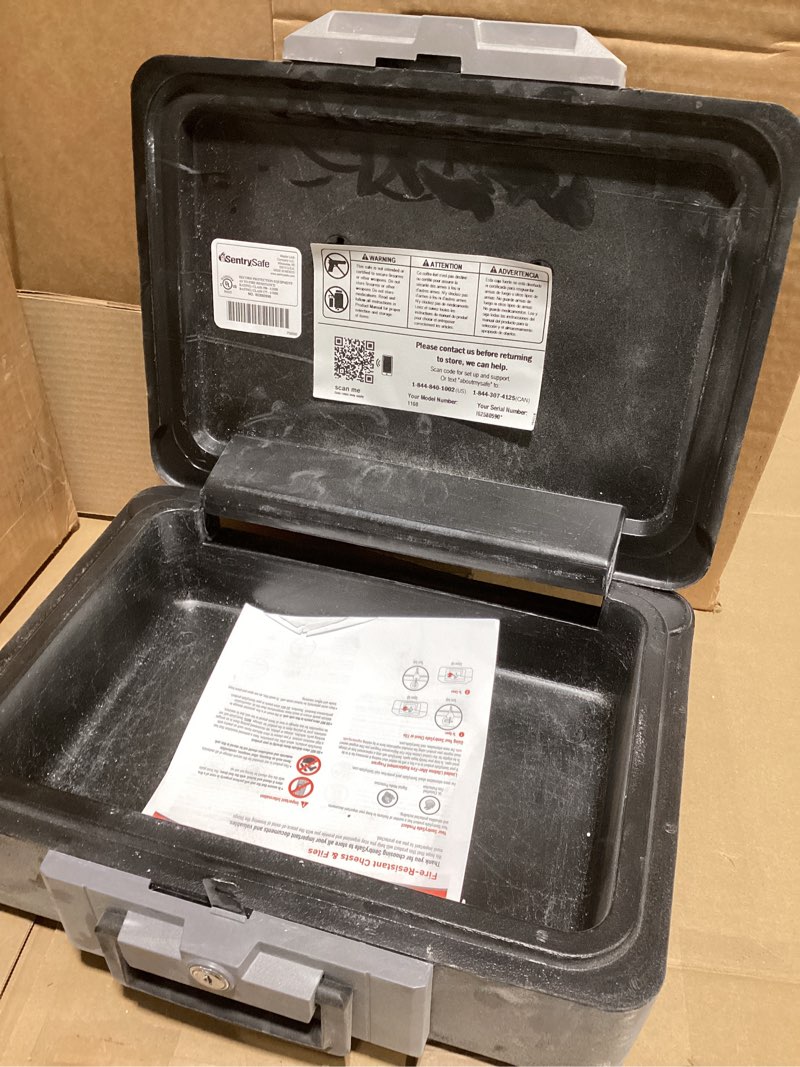 Condition photo showing As Is for SentrySafe Fireproof Safe Box with Key Lock, Chest Safe with Carrying Handle to Secure Money, Jewelry, Documents, 0.25 Cubic Feet, 6.3 x 15.3 x 12.1 Inches, 1160 Fire resistant box 0.25 cu. ft.