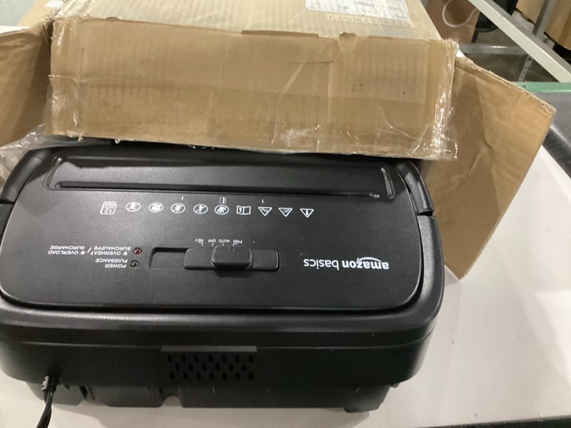 Condition photo showing As Is for Amazon Basics Cross Cut Paper and Credit Card Shredder, 12 Sheet (New Model), Black 12 Sheet Black