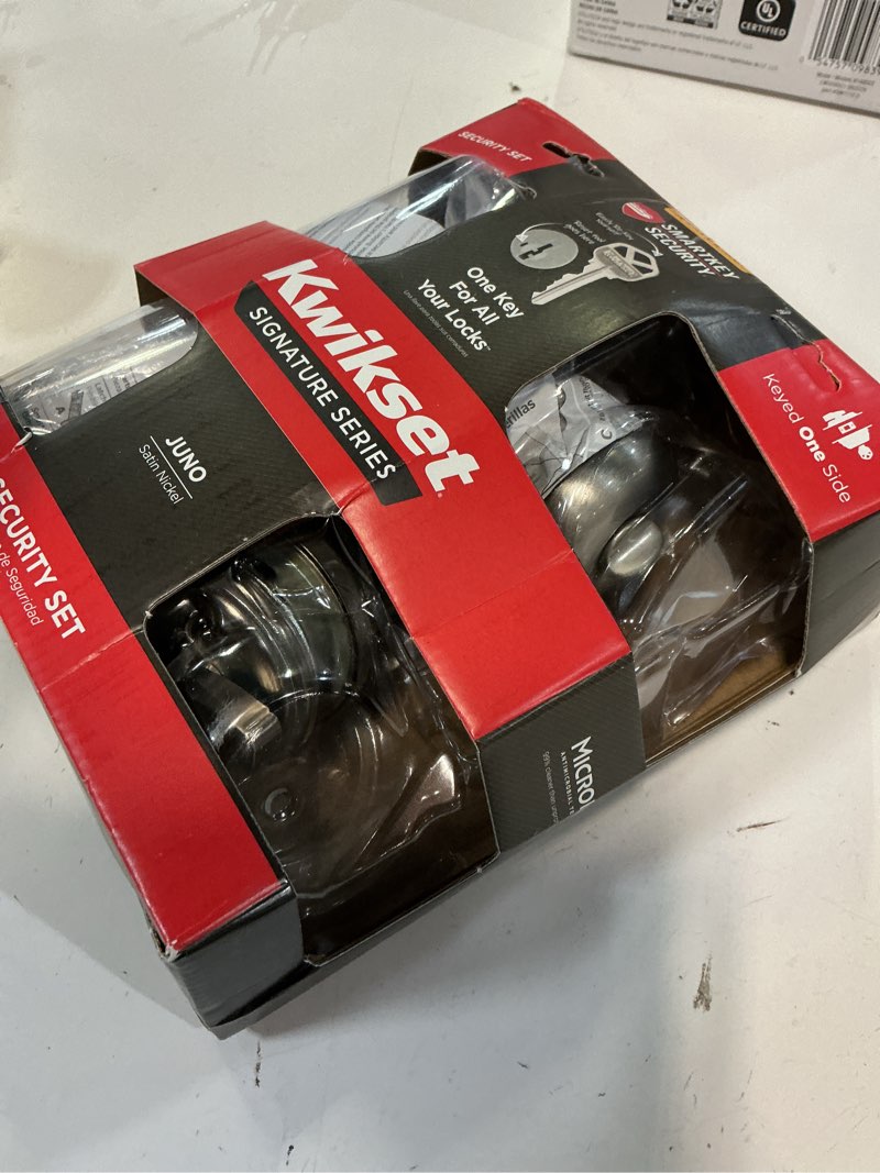 Condition photo showing As Is for kwikset smartkey juno satin nickel deadbolt and entry door knob kw1 1-3/4 in.