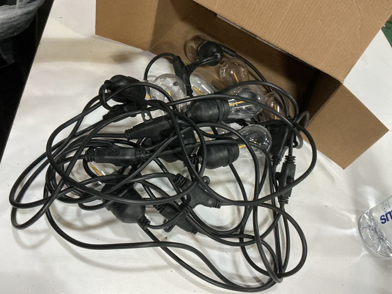 Condition photo showing As Is for harbor breeze 48-ft solar black indoor/outdoor string light with 20 white -light led edison bulbs