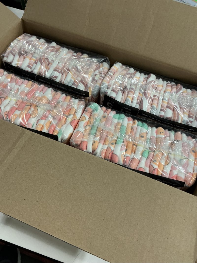 Condition photo showing New/Like New for the honest company comfort dry disposable diapers for sensitive skin, hypoallergenic, wingin' it + catching rainbows, super club box size 5 (27 lbs) 84 count size 5 (84 count) wingin' it + catching rainbows