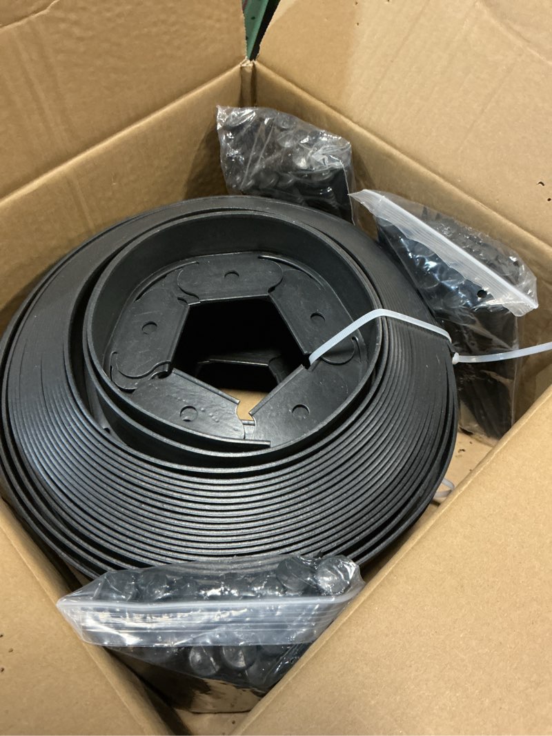 Condition photo showing New/Like New for 1.5 inch x 100ft garden edging kit with 90 spikes for landscaping, plastic lawn edging border for flower beds, tree rings, pathways, black 1.5in x 100ft